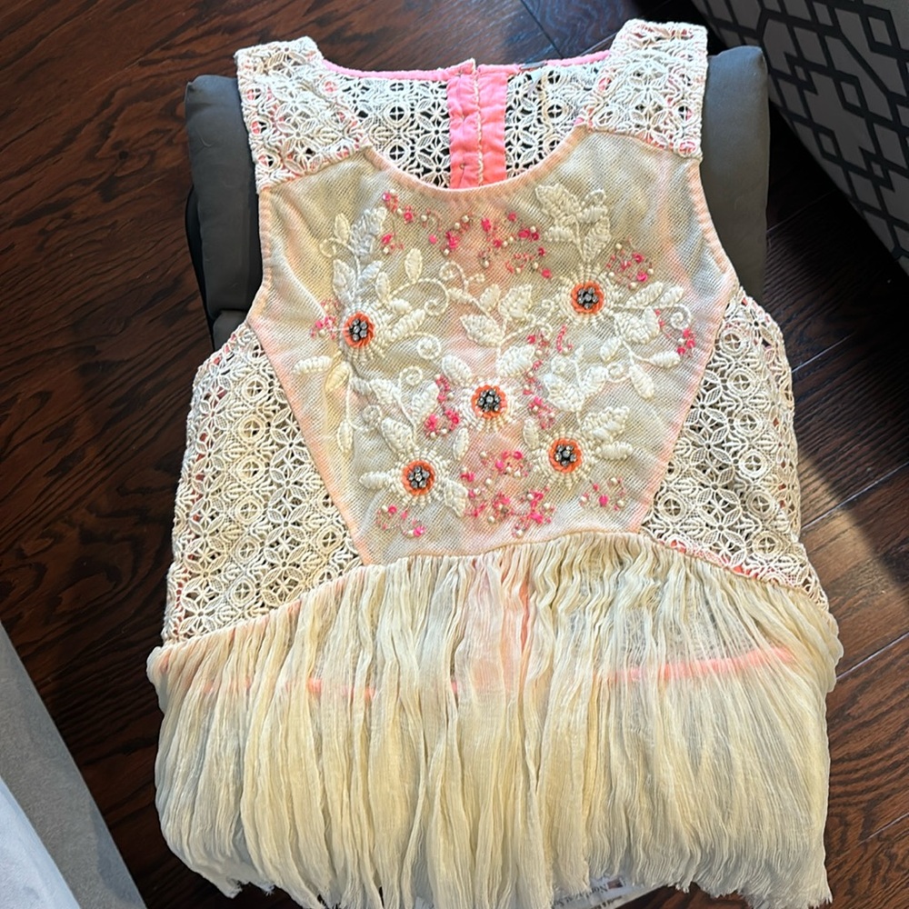 Free People beaded swing tank Shoulder strap to bottom is about 22”.
